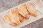 Grilled Chicken Wings On Wooden Plate Stock Photo