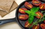 Baked Cherry Tomatoes With Basil And Thyme Stock Photo