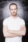 Young Male With Crossed Arms Stock Photo