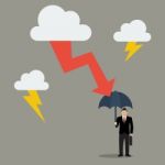 Businessman With Umbrella Protect From Thunderstorm Stock Photo