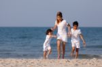 Asian Family On Beach Stock Photo