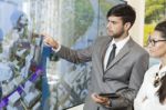 Business Man Holding A Presentation Stock Photo