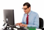 Portrait Of An Accountant Working On Computer Stock Photo