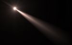 Abstract Digital Lens Flare In Black Background Stock Photo