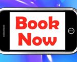 Book Now On Phone Shows For Hotel Or Flight Reservation Stock Photo