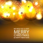 The Merry Christmas And Gold Bokeh Background Stock Photo