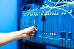 People Fix Core Switch In Network Room Stock Photo