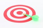 Light Green Dart On Center Of Target Stock Photo