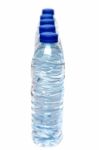 Row Of Plastic Water Bottles Isolated On A White Background Stock Photo