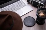 Closeup Of A Wooden Table With Laptop Stock Photo