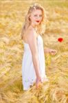 Portrait Of Beautiful Girl In Field Stock Photo