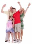 Happy Family Raising Their Hands And Having Fun Stock Photo