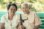 Happy Senior Couple Posing For A Selfie Stock Photo