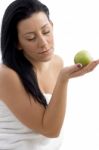 Side View Of Woman Posing With Apple Stock Photo