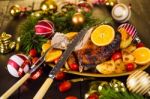 Christmas Baked Duck Served With Potatoes, Orange And Tomatoes Stock Photo