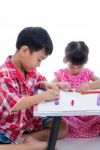 Asian Kids Playing With Play Clay On Table. Strengthen The Imagi Stock Photo