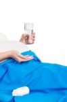 Pregnant Woman With Glass Of Water And Tablets In Hand Stock Photo