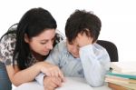 Mother Helping With Homework Stock Photo