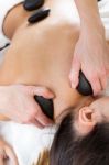 Woman Enjoying Massage At Beauty Spa Stock Photo