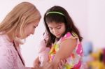 Lady Doctor Injecting Girl Stock Photo