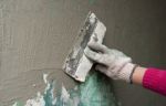 Hand With A Trowel Plaster Wall Stock Photo