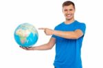 Young Male Holding Globe Stock Photo