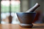 Wooden Mortar And Pestle On A Wooden Desk And Living Room Background Stock Photo