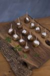 Skewers Of Meat On Wooden Cutting Board Stock Photo