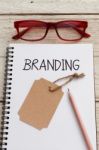 Branding With Brand Tag On Notebook Stock Photo