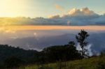 Beautiful Sun Rise On Top Mountain With Sun Ray Warm Tone Stock Photo