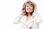 Pretty Lady Enjoying Rock Music Stock Photo