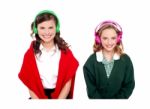 Smiling students Listening Music Stock Photo