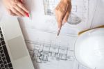 Architects Discussing At The Table With Blueprint - Closeup On H Stock Photo