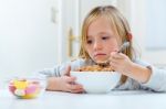 Beautiful Child Having Breakfast At Home Stock Photo