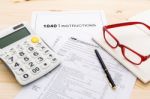 Income Tax Income Return Form With Pen And Calculator Stock Photo