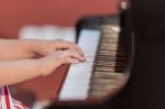 Girl Plays Piano Stock Photo