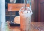 Take-home Ice Coffee Cup On Wooden Table Stock Photo