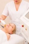 Woman Getting Light Pulsed Hair Removal Treatment Stock Photo