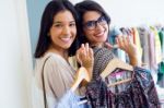 Two Beautiful Girls Shopping In A Clothes Shop Stock Photo