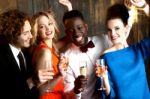 Couples Enjoying Champagne Or Wine At A Party Stock Photo