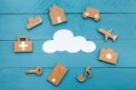 Cardboard Web Icons  And White Cloud On Blue Background Stock Photo