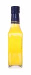 Front Yellow Glass Liquor Bottle On White Background Stock Photo