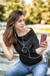 Woman Listens Music Stock Photo