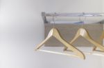 Wood Cloth Hanger On Metal Rail And Wood Panel Stock Photo