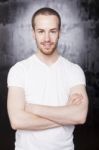 Young Male With Crossed Arms Stock Photo