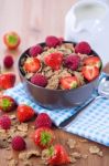 Bran Flakes With Fresh Raspberries And Strawberries And Pitcher Stock Photo