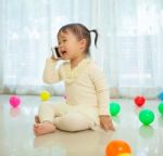 Little Girl Talking On Mobile Phone Stock Photo