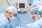 Surgeons Team Working In The Operation Room Stock Photo