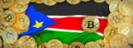 Bitcoins Gold Around South Sudan  Flag And Pickaxe On The Left.3 Stock Photo