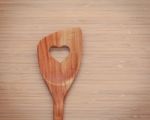 Wooden Cooking Utensils Border. Wooden Spatula With Heart Shape Stock Photo